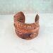 Very rustic fold formed copper cuff bracelet with braille "I am enough" Contracted Grade 2 Braille Perkins E-Z Read Slate.